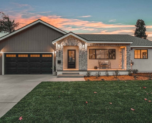 Modern Home Exterior with Stone Accents and Dark Garage Door