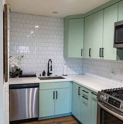 Modern ADU Kitchen with Sage Green Cabinets and White Subway Tile Modern ADU Kitchen with Sage Green Cabinets and White Subway Tile